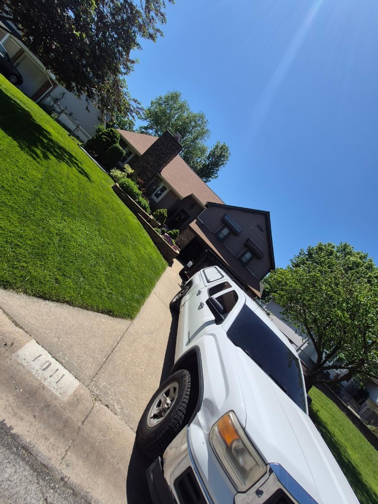 Heavy Removal truck parked in front of a house